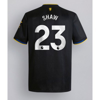 Moški Nogometni dresi Manchester United Luke Shaw #23 Tretji 2025-26 Kratek Rokav Moški Nogometni dresi Manchester United Luke Shaw #23 Tretji 2025-26 Kratek Rokav